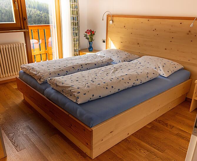 Camera da letto dell’appartamento vacanze “Fanes”